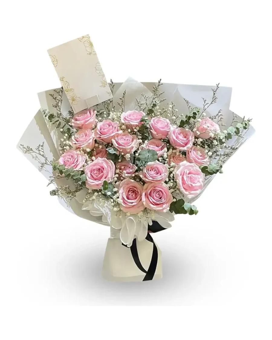 Buket mawar pink dengan kartu ucapan